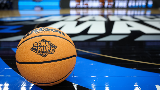 A basketball with the NCAA Tournament logo rests at midcourt.