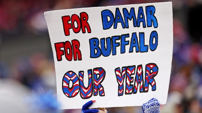 Buffalo Bills fan holding sign supporting Damar Hamlin