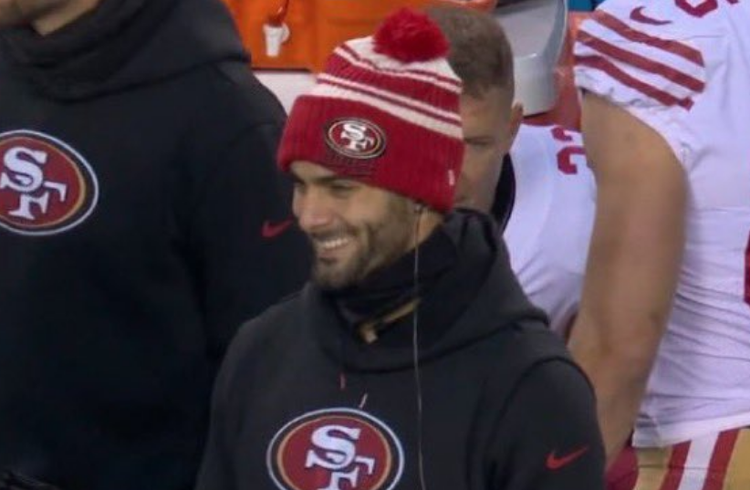 Jimmy g smiling on the sidelines 