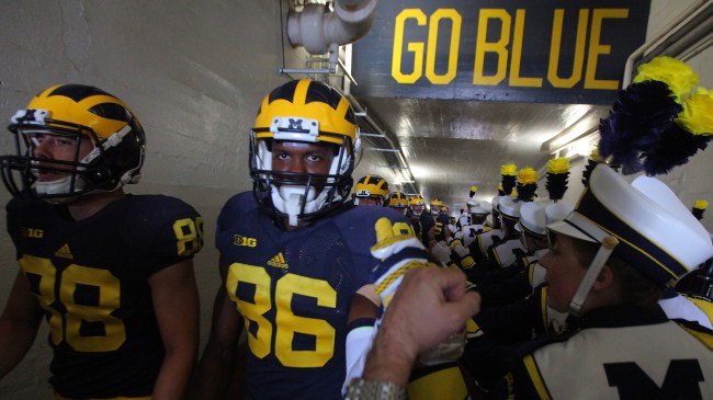 University of Michigan football players walking down tunnel inside The Big House