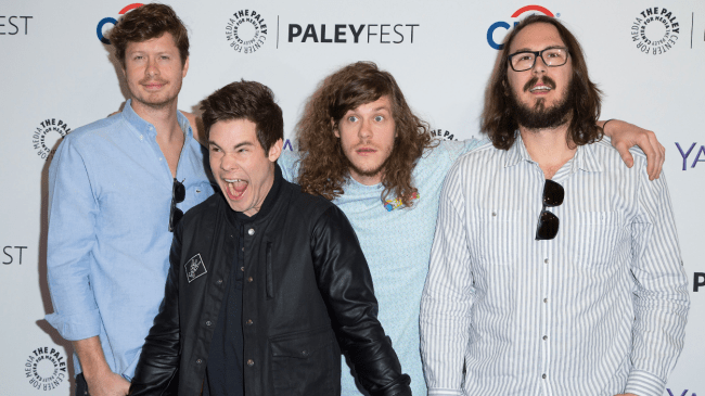 Actors from "Workaholics" pose for a photo.