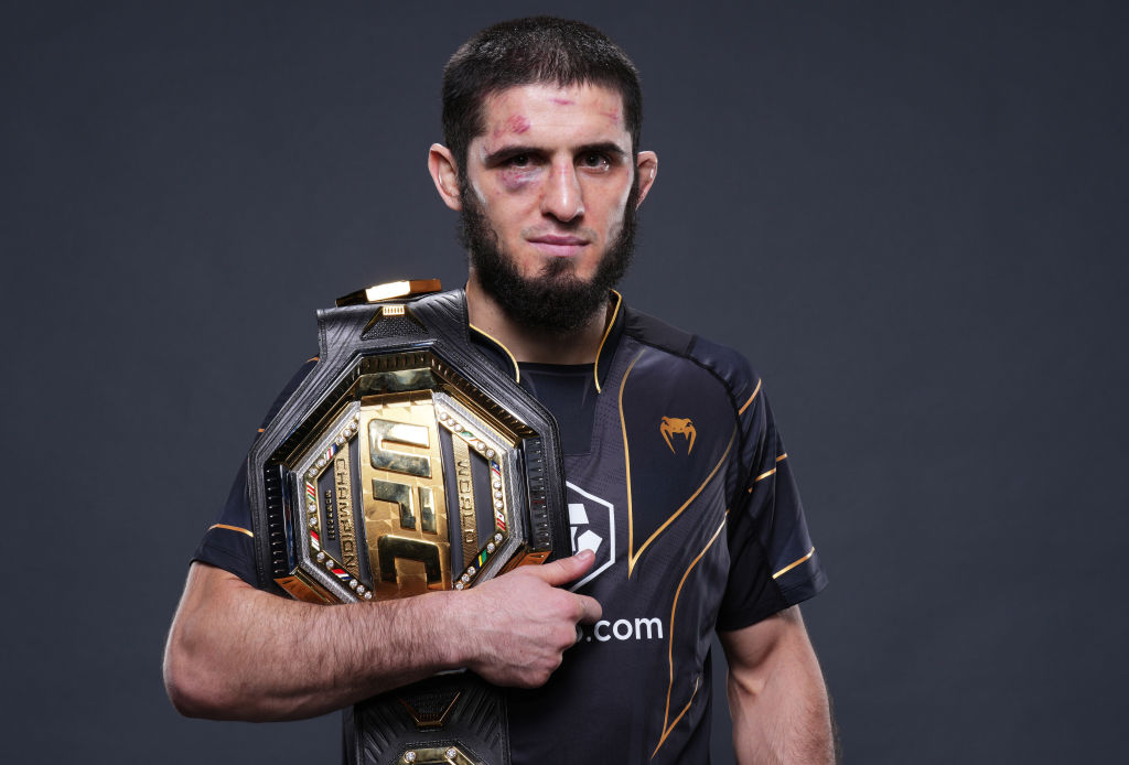 Islam Makhachev holding UFC belt