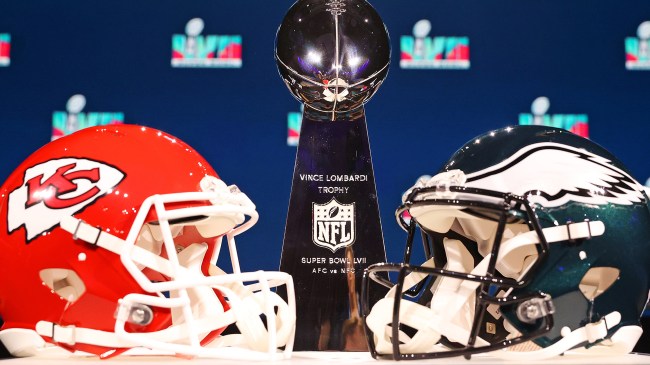 Chiefs and Eagles helmets in front of Lombardi Trophy at Super Bowl LVII