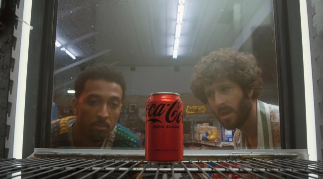 Lil Dicky and Travis Bennett staring at a can of Coke Zero Sugar in a Coke Zero Sugar commercial 
