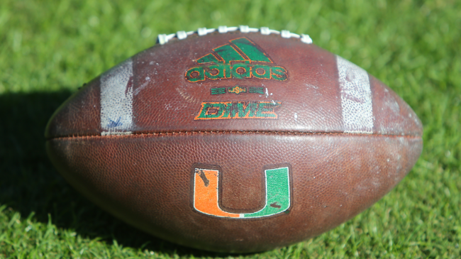 A Miami Hurricanes logo on a football.