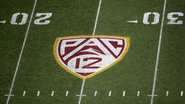 A PAC 12 logo on the football field.