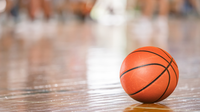 A basketball on a court.