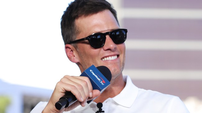 Tom Brady holding microphone