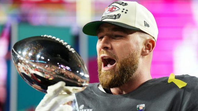 travis kelce holding the super bowl