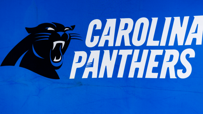 A Carolina Panthers logo on the stadium wall.