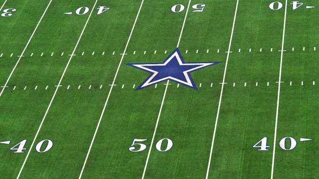 The Dallas Cowboys logo at midfield.
