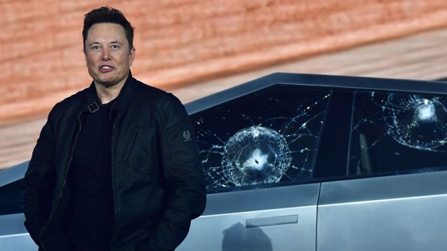 Elon Musk standing next to Tesla Cybertruck