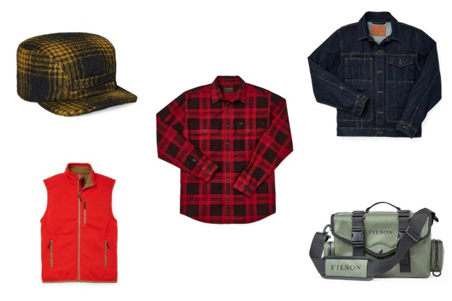 Select items from the Filson warehouse sale, including a yellow and vlack hat, a red vest, a red plaid shirt, a denim jacket, and a piece of luggage