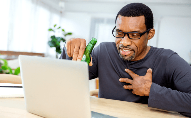 man drinking beer laptop drunk shopping