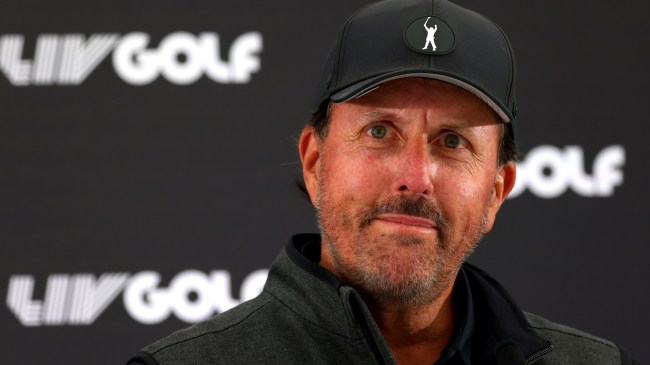 Phil Mickelson in front of LIV Golf logo