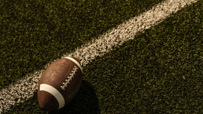 A football lays on the field.