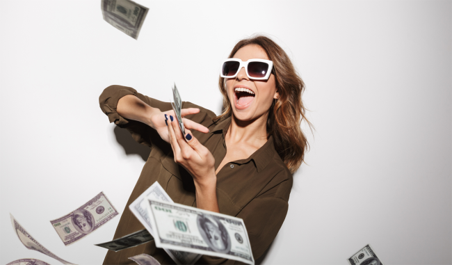 woman throwing money buys happiness study research