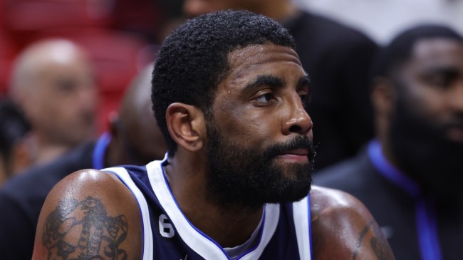 Kyrie Irving looks grim on the bench