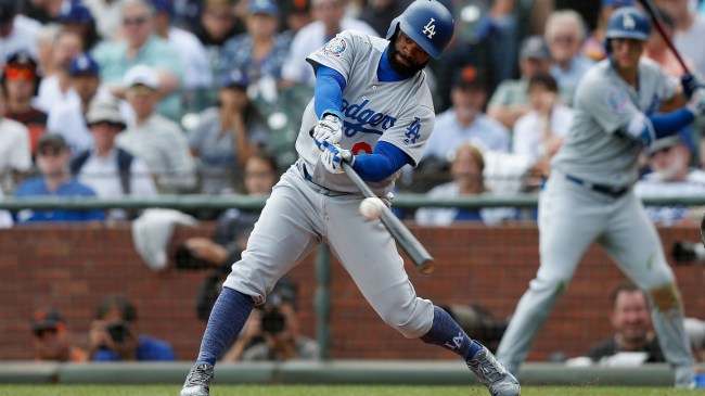 Andrew Toles hits a ball in a game against the Giants.