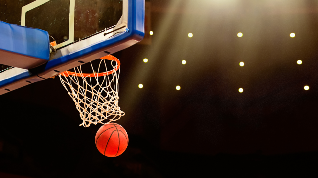 A ball goes through the basketball hoop.
