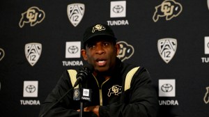 Deion Sanders talks to the media during a Colorado press conference.