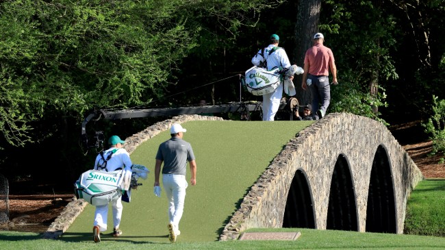 Jon Rahm and Brooks Koepka walk the course at the Masters.