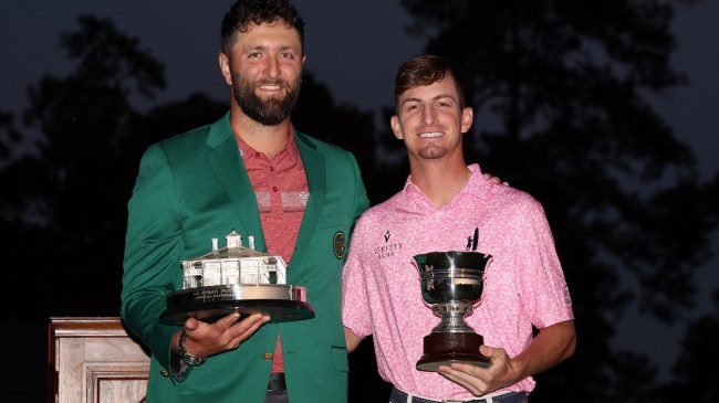 Sam Bennett and Jon Rahm pose for a photo at the Masters.