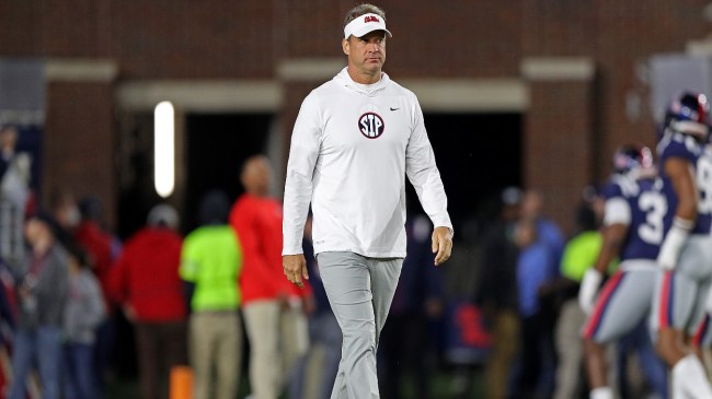 Lane Kiffin walks onto the field before an Ole Miss game.