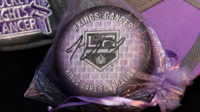 Los Angeles Kings logo on puck on "Hockey Fight Cancer" night