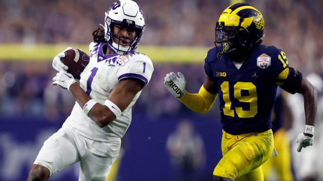 TCU WR Quentin Johnston evades a Michigan defender in the College Football Playoff.
