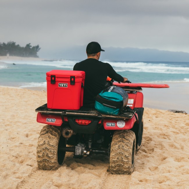 YETI cooler in rescue red on a Hawaiian lifeguard's ATV on a beach