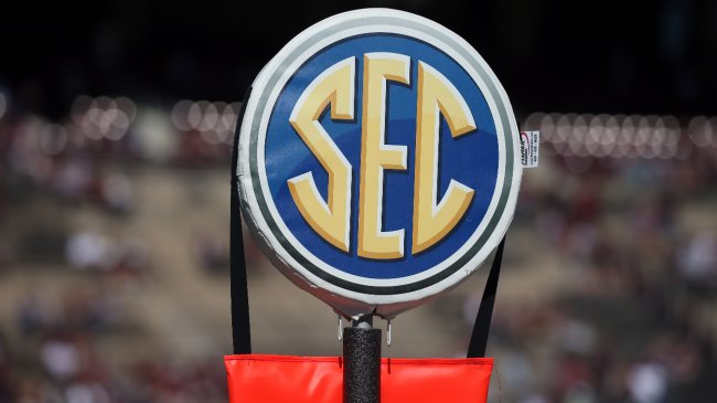 An SEC logo atop a first-down marker.