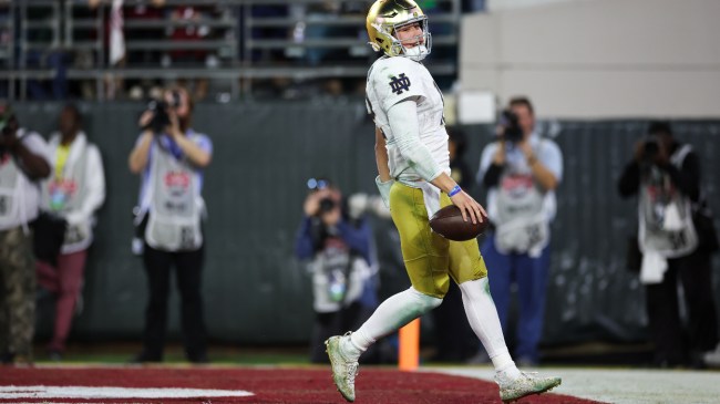 Tyler Buchner scores a touchdown in Notre Dame's bowl game vs. South Carolina.