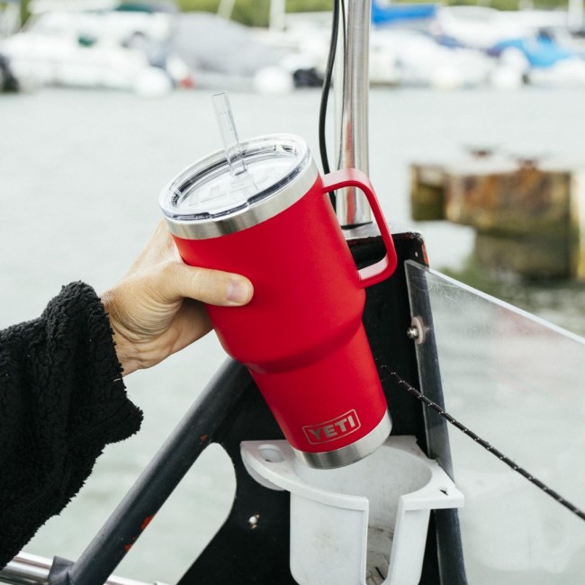 Woman holding Rescue Red color YETI Rambler Mug with straw lid in her hand