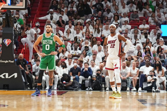 MIAMI, FL - MAY 17: Jayson Tatum #0 of the Boston Celtics and Jimmy Butler #22 of the Miami Heat look on during Game 4 of the 2022 NBA Playoffs Eastern Conference Finals on May 17, 2022 at The FTX Arena in Miami, Florida.