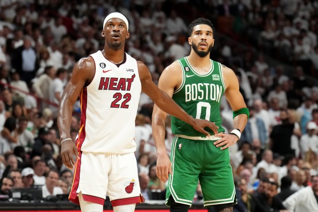 Jimmy Butler #22 of the Miami Heat and Jayson Tatum #0 of the Boston Celtics look on during Game 4 of the 2023 NBA Playoffs Eastern Conference Finals on May 23, 2023 at Miami-Dade Arena in Miami, Florida. 