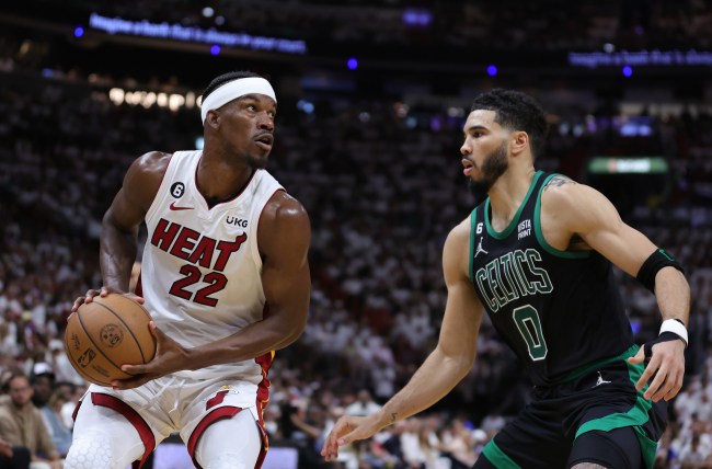 MIAMI, FLORIDA - MAY 21: Jimmy Butler #22 of the Miami Heat drives against Jayson Tatum #0 of the Boston Celtics during the third quarter in game three of the Eastern Conference Finals.