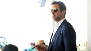 aaron rodgers wearing sunglasses and smoking a ciagr
