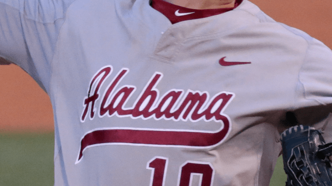 An Alabama Crimson Tide logo across the front of a baseball jersey.