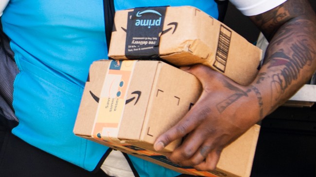 Amazon delivery driver holding packages