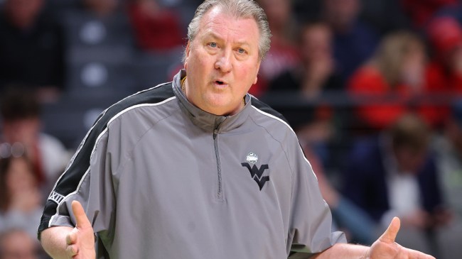 Bob Huggins questions a play from the bench.