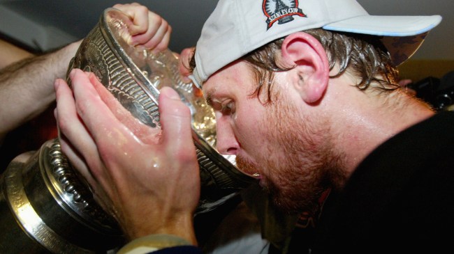 NHL player Brian Richards drinks beer from the Stanley Cup