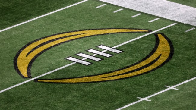 A College Football Playoff logo on the field.