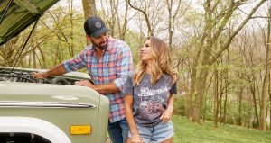Eric Decker and his wife, Jesse James Decker pictured with the hood open on an old Ford Bronco