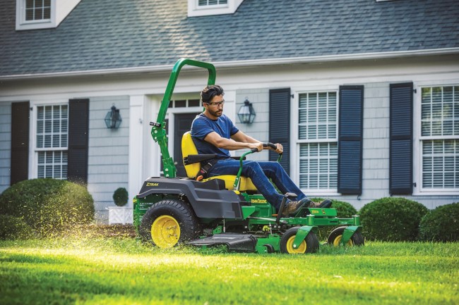 Man mowing the lawn in a John Deere Z530M Zero Turn mower