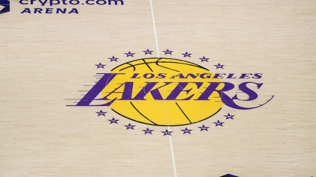 A Los Angeles Lakers logo at midcourt.