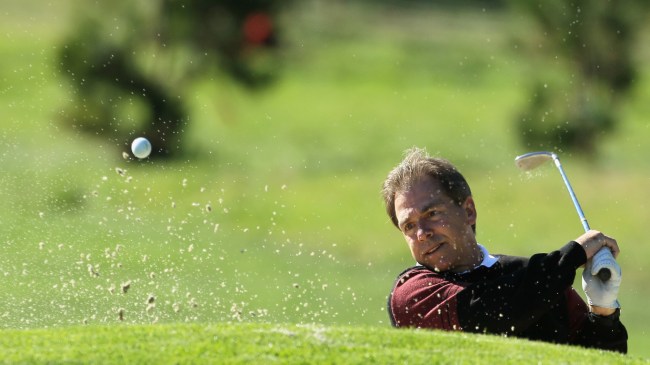 Nick Saban takes a shot from the bunker at the AT&T Pebble Beach National Pro-Am.