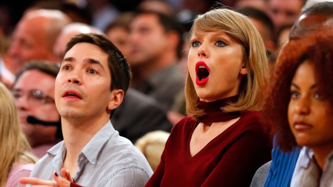 Taylor Swift and Justin Long attending an NBA game