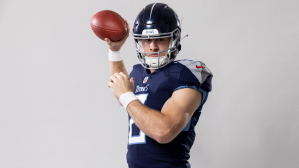Will Levis poses for a Titans photoshoot.