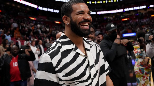 Drake celebrates after an NBA game.